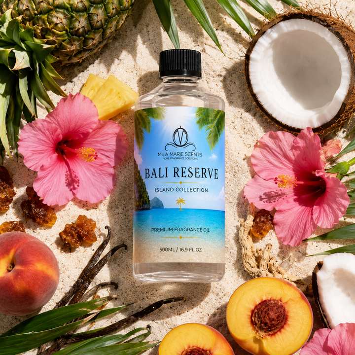 Bottle of Bali Reserve fragrance oil surrounded by tropical fruits and flowers on sand