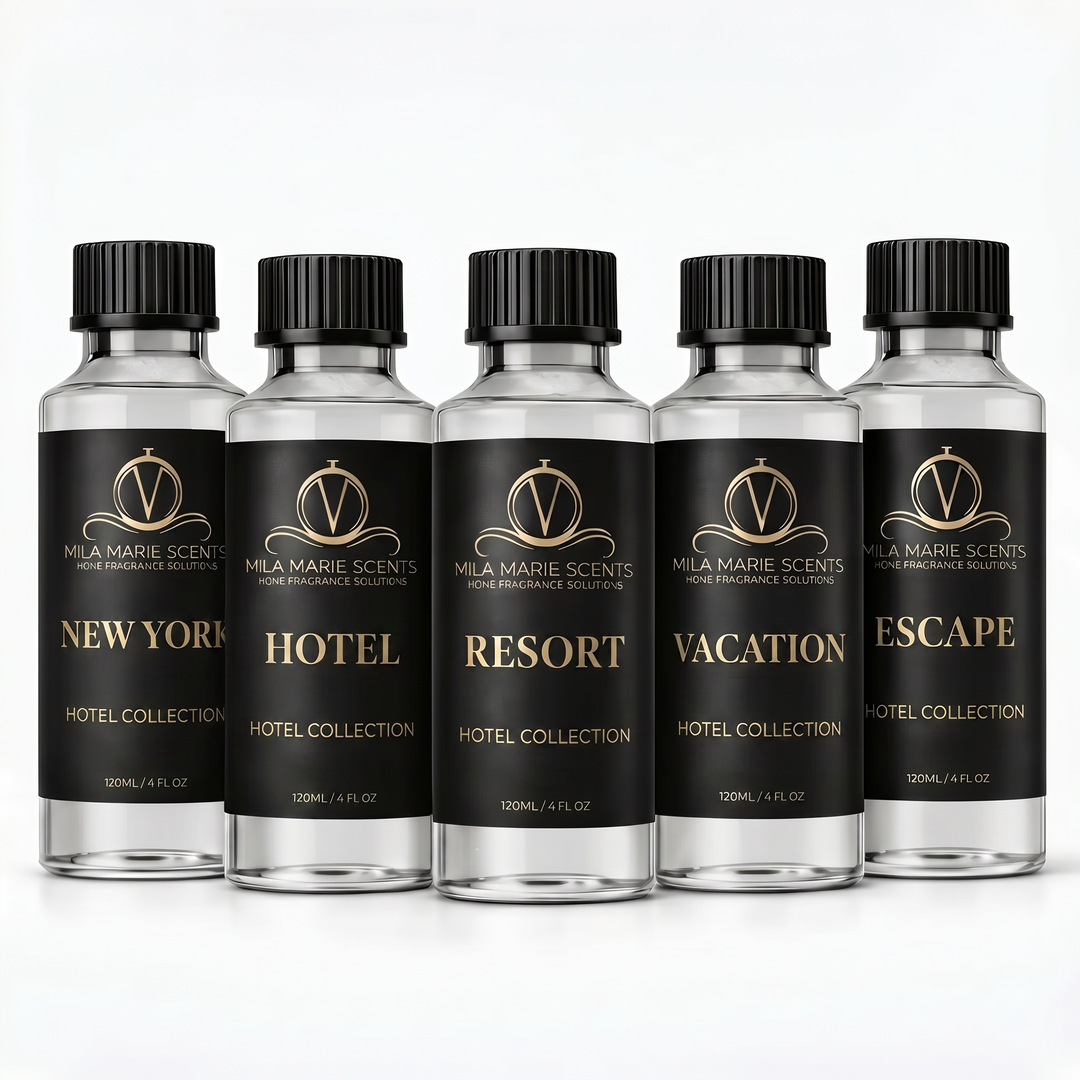 Five bottles of Mila Marie Scents Hotel Collection with black labels on a white background