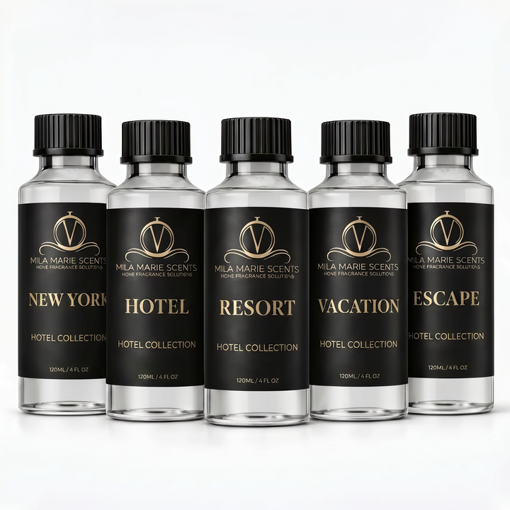 Five bottles of Mila Marie Scents Hotel Collection with black labels on a white background