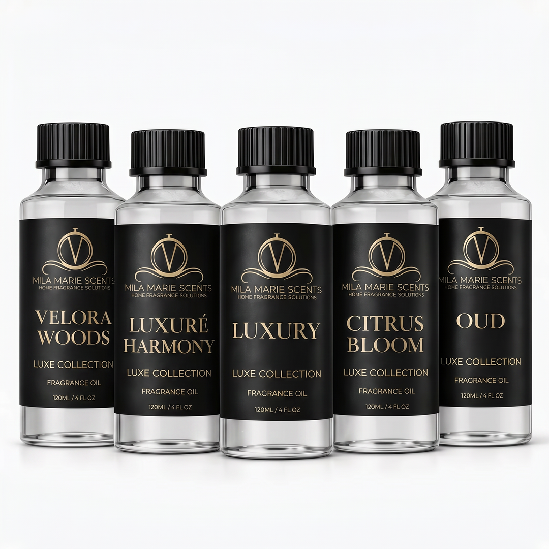 Five bottles of Mila Marie Scents fragrance oils on a white background