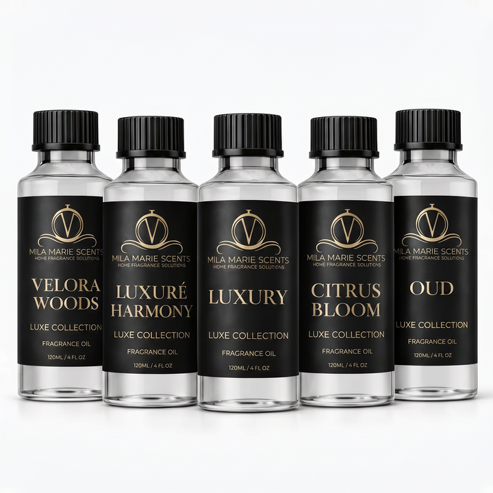 Five bottles of Mila Marie Scents fragrance oils on a white background