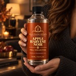Apple Harvest Noir fragrance oil in dark moody luxury interior setting
