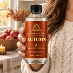Autumn cold-air diffuser oil bottle with warm amber lighting
