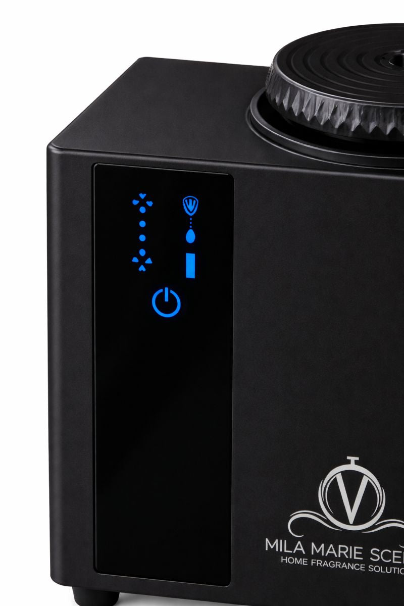 Black home fragrance solution device with control panel and visible brand logo.